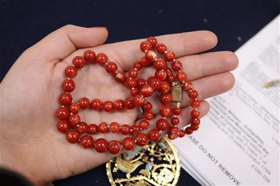 A Chinese 18ct gold and multi gem set pierced circular pendant, one other pendant and two items of coral.